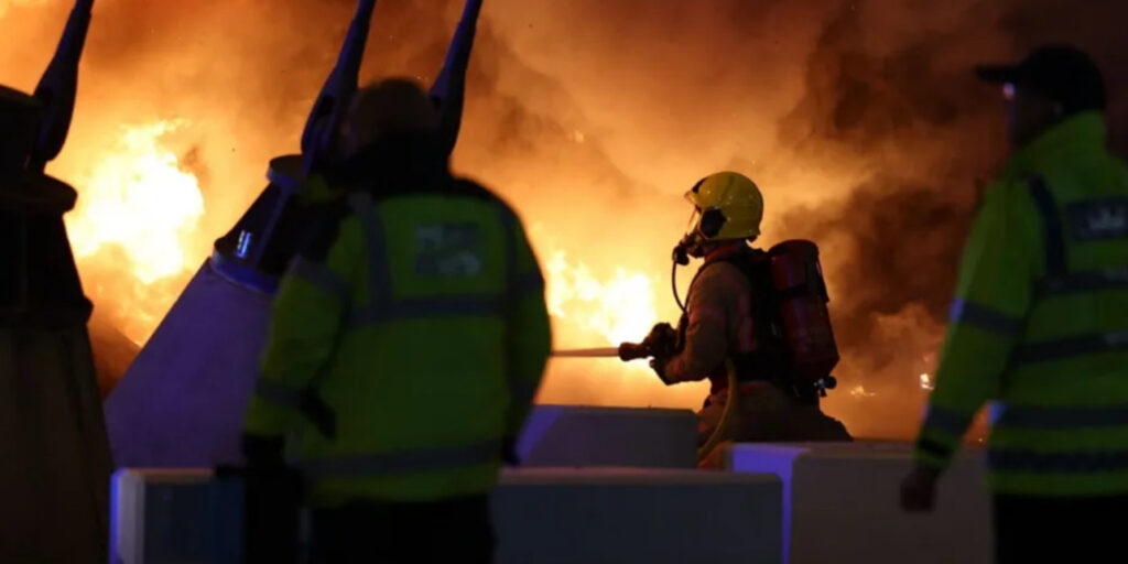 UK Fire Services Face Funding Gap OR Fire Crews in England Hit by Budget Shortfall OR UK Fire Funding Falls Short Fire services across England are facing a significant funding shortfall, receiving just half the government support provided to police forces to cover the recent rise in National Insurance contributions (NICs). This financial strain raises concerns over the ability of fire and rescue services to maintain essential operations and safety standards. Following the Chancellor's Budget announcement, employer NICs increased from 13.8% to 15%. While police forces have received an additional £230 million from the government to fully cover this cost, fire services have only been compensated for around 50% of their increased wage bills on average. According to analysis, the shortfall is equivalent in some cases to the running cost of a fully staffed fire engine. The discrepancy affects the 31 fire authorities directly funded by the government. Despite the provision of £502 million in top-up grants for councils and fire authorities, the National Fire Chiefs Council (NFCC) estimates that fire services still face a £20 million deficit out of the £40 million needed. Data compiled from 43 fire authorities by the BBC shows that the average funding shortfall is around 50%. Some areas, like West Yorkshire and Humberside, face even greater gaps—67% and 60% respectively—while Essex sees the lowest shortfall at 17%. The government has defended its overall funding support for local services, but fire sector leaders argue that the response fails to ensure parity between emergency services. While the Home Office has acknowledged the £40 million cost of the NICs rise for all fire services, no additional plans have been announced to close the gap. Fire authorities operate under a complex system with different funding models. Of the 31 receiving direct government grants, five are led by metro mayors, while the remaining 26 are combined fire authorities, five of which also fall under Police, Fire and Crime Commissioners (PFCCs). An additional 10 fire services are managed by county councils, where NICs funding is pooled with broader council staff budgets, making the fire-specific impact less transparent. Greater Manchester Fire and Rescue Service has reported a likely 50% funding shortfall, while the Mayor of London had to provide an extra £2.5 million to help offset a £4.4 million deficit in the capital. Union representatives warn that this funding gap follows over a decade of underinvestment in fire services. Without full coverage of the NICs increase, many fear the cuts will impact fire engine availability, staff retention, and the overall safety of communities.